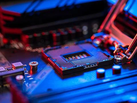 Manipulating and installing processor on the motherboard in details with blur Stock Photos