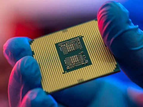 Manipulating and installing processor on the motherboard in details with blur Stock Photos