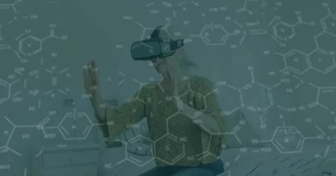 Manipulating molecules woman in patterned blouse using VR headset in bedroom, Stock Photos