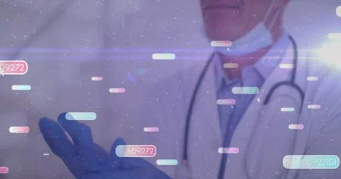 Manipulating pastel data blocks in clinical exam room, senior doctor wearing Stock Photos