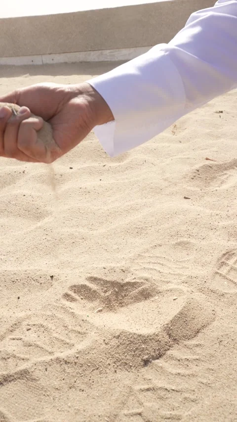 Manipulating Sand on Beach Stock Footage 315787276