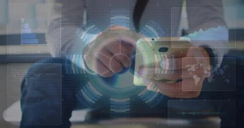 Manipulating smartphone blazer-clad man examining floating holographic charts in Stock Photos