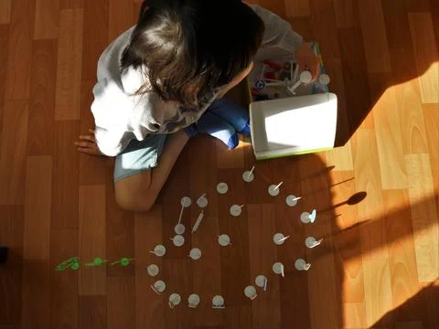 Manipulation with objects in a child on the autism spectrum Stock Photos