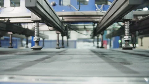 Manipulator with vacuum suction cups above conveyor line Stock Footage 228780406