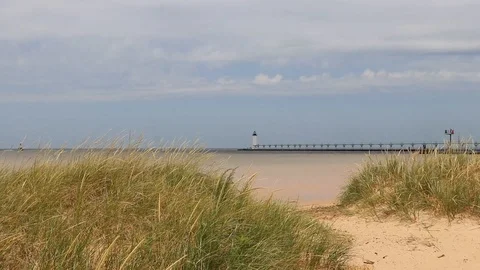 Manistee Lighthouse from Dune Grass Shoreline – Lake Michigan Coast Stock Footage 115954162