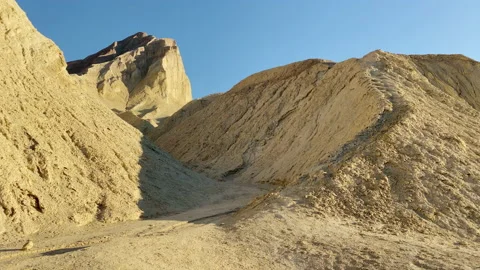 Manly Peak in the background of one of the canyons at Golden Canyon at DV Stock Footage 217439742