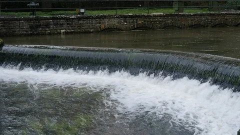 A manmade waterfall flows in slow motion Stock Footage 126714355