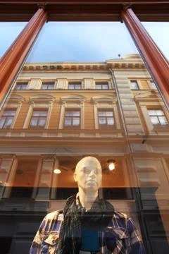 Mannequin behind thw window. riga, latvia. Stock Photos