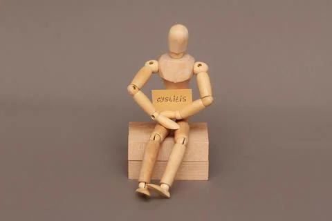 A mannequin with a cystitis sign demanstrates the problem of urination. Stock Photos