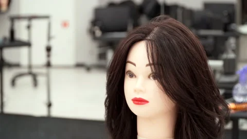 Mannequin head for practicing hairdressing Stock Footage 164058943