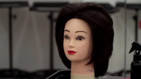Mannequin head for practicing hairdressing 스톡 동영상 164070103