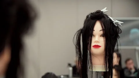 Mannequin head for practicing hairdressing Stock-Footage 164107967