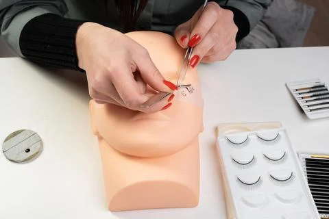 Mannequin training head with false eyelashes for extension practice. Traini.. Stock Photos