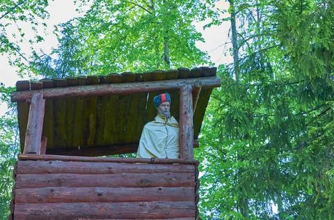 A mannequin in the uniform of a Soviet partisan stands on an observation towe Stock Photos