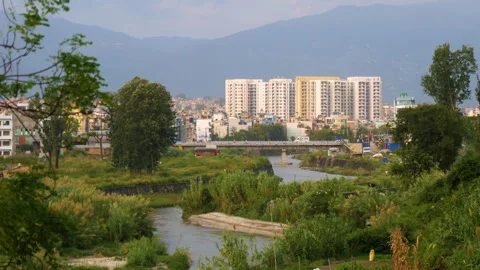 Manohara River flowing through green Nature and Urban city Stock Footage 258636230