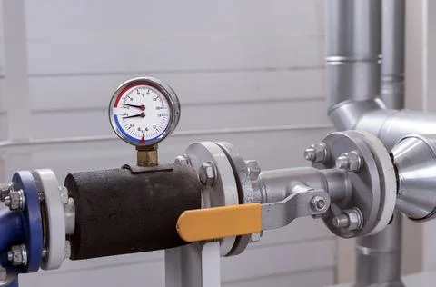 Manometer and thermometer for measuring the temperature and pressure of water. Stock Photos
