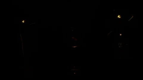 Manometer between two decorative filament light bulbs is on and slowly fades out Stock Footage 127886398