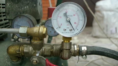 Manometer working on a compressor with jumping arrow close up Stock Footage 180600032