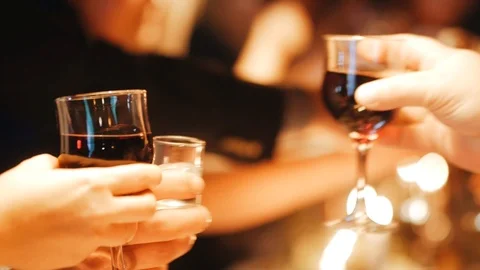 Mans and womans clinking glasses with champagne, happy friends celebrating xmas 動画素材 124695947