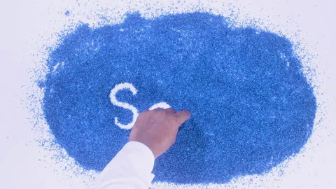 Man's arm writing in the blue particles the word Sad Stock Footage 248537454