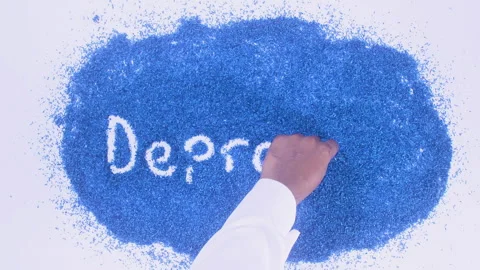 Man's arm writing in the blue particles the word Depression Stock Footage 248537546