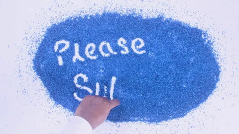Man's arm writing in the blue particles the words Please subscribe Stock Footage 248538143