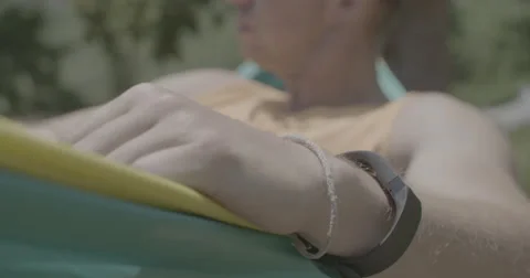 Mans bracelet while in hammock Stock Footage 65192327