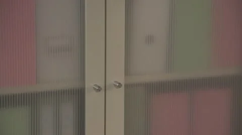 Man's comes and opens the door from office cupboard Stock Footage 60811692