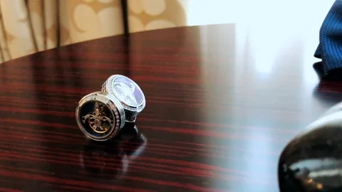  Man's cufflinks on white background closeup Stock Footage 124247498