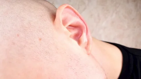 A man's ear. A man's left ear. Concept of hearing, human ear, study,hearing 스톡 동영상 281209062