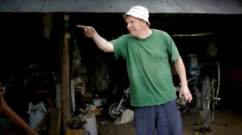 Man's emotion in garage Stock Footage 38014229