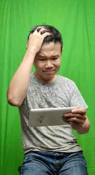 A Man's Expression Reflecting Apprehension and Unease with his Fearful Gaze Foto stock