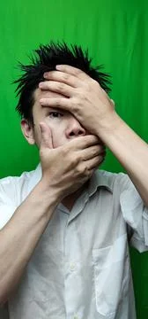 A Man's Expression Reflecting Apprehension and Unease with his Fearful Gaze Stock Photos