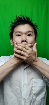 A Man's Expression Reflecting Apprehension and Unease with his Fearful Gaze Stock Photos