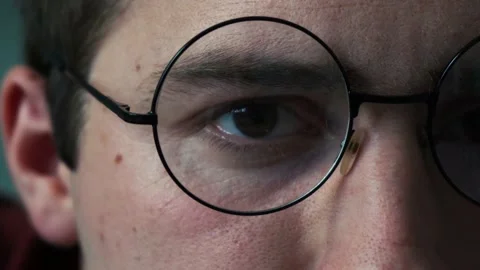 Man's eye in round glasses close up 스톡 동영상 162411149