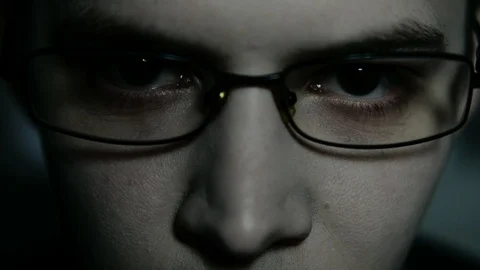 The man's face appears out of the darkness. Depression. Isolated. Paranoic Stock Footage 88950026