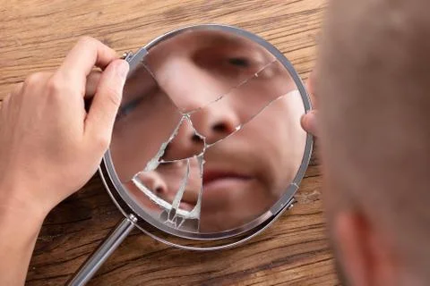 Man's Face In Broken Mirror Stock Photos