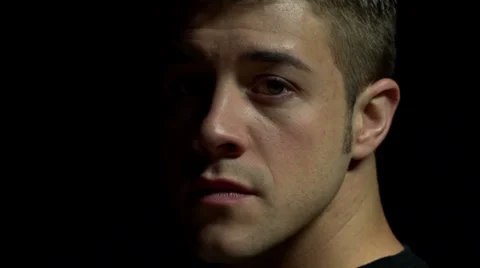 Man's face, turns away from camera Stock Footage 23136264