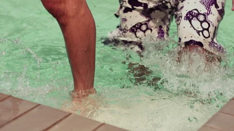 Man's feet getting out of pool in slow motion Stock Footage 53805479