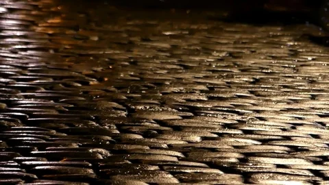 Man`s Feet Moving Down a Cobblestone Street Ina Respectable Way at Night. Stock Footage