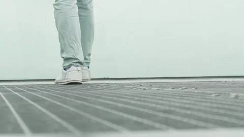 A mans feet walk along a platform towards an abyss on a foggy day. The concept Stock Footage 278818173