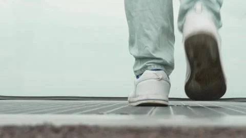 A mans feet walk along a platform towards an abyss on a foggy day. The concept Stock Footage 278818204