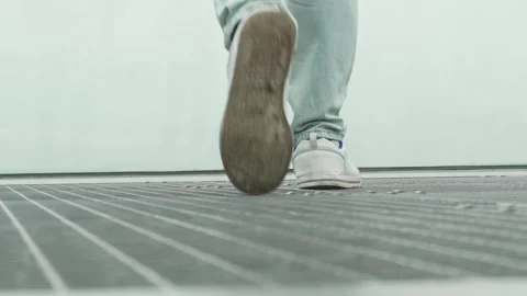 A mans feet walk along a platform towards an abyss on a foggy day. The concept Stock Footage 278818208