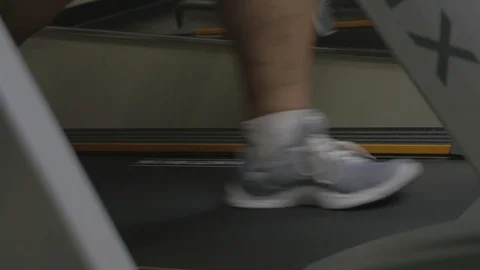 Man's feet walking on treadmill (close up) variant. Stock-Footage 101776495