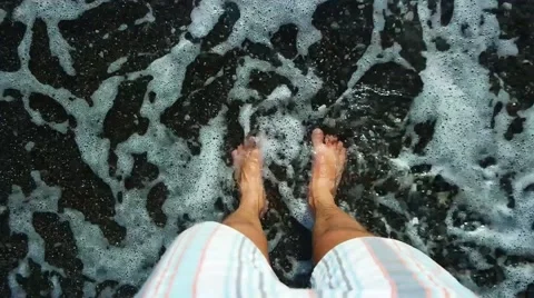 Man's feet washed by sea waves. Top view. Stock Footage 59777250