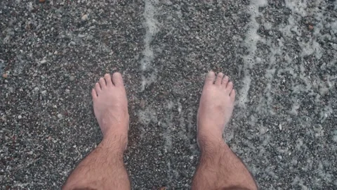 Man's Feet In Waves At Beach Close-Up Stock Footage 169864565