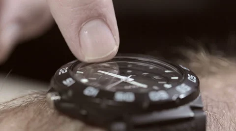 Man's finger tapping his watch. He's late or he's waiting. Stock Footage 55498641