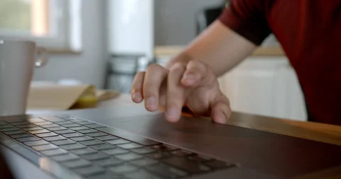 Man's finger using a laptop trackpad while scrolling website and browsing Stock Footage 170635373
