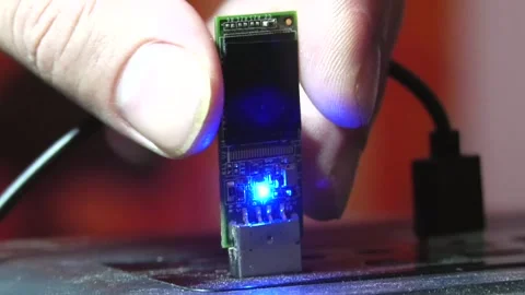 A man's fingers inserting a flash drive into a computer's USB port Video stock 346882029