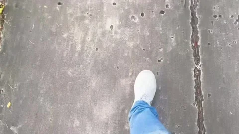 A man's footsteps on the jogging track Stock Footage 296489816